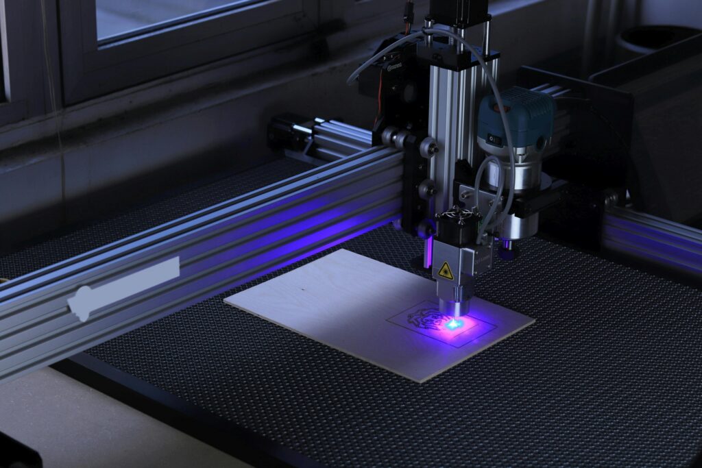 SEO FOR E-COMMERCE COMPANY UK machine cutting in a factory with purple light
